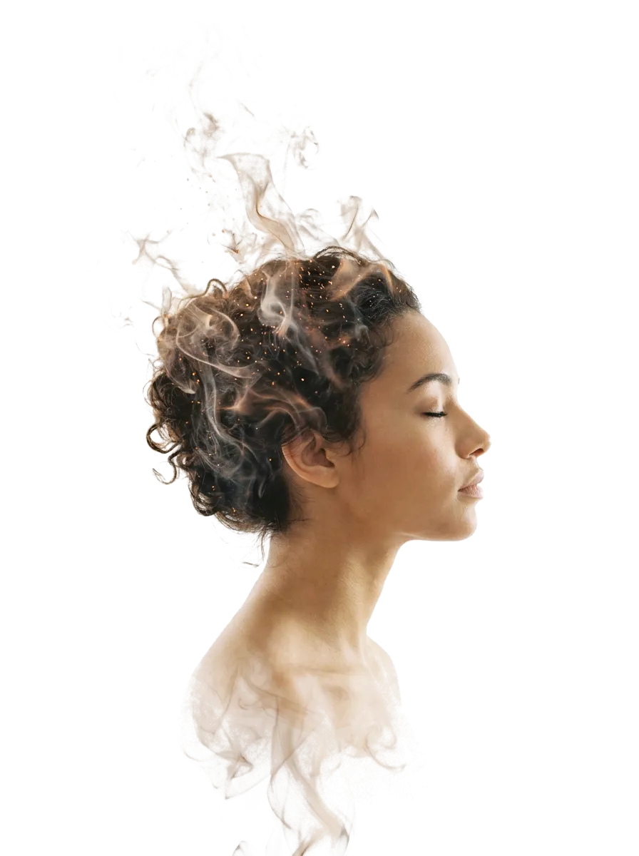 Serene profile portrait dissolving into soft light mist and particles